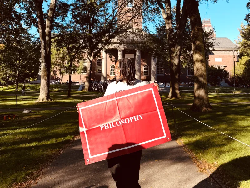 Me standing with my Philosophy banner on Concentration Declaration Day 