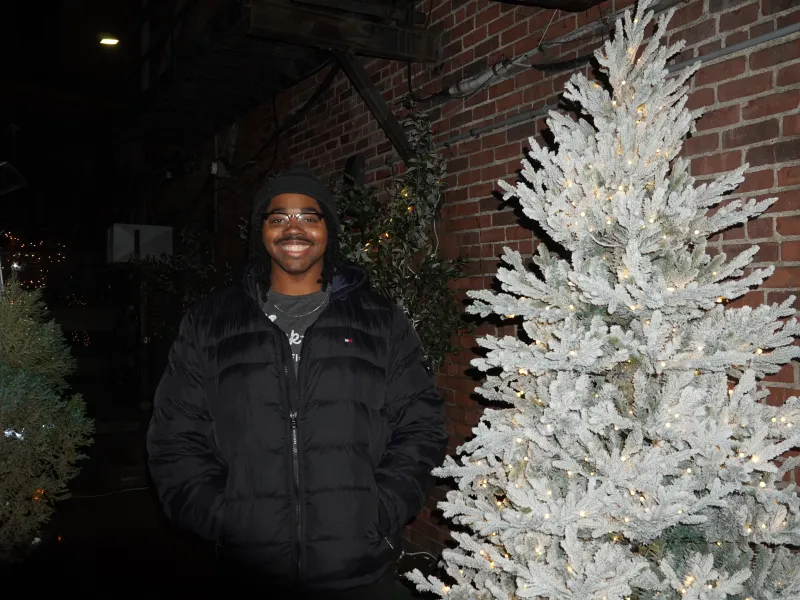 Me standing next to a white tree