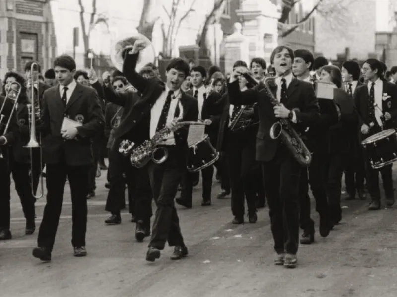 A black and white image of the 1987 Harvard Band marching.
