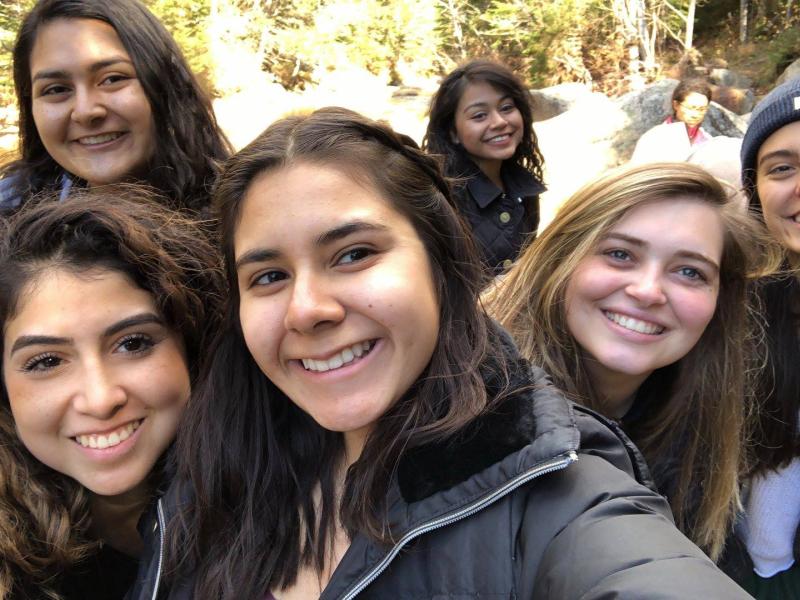 A picture of author with other LU board members near a hiking trail