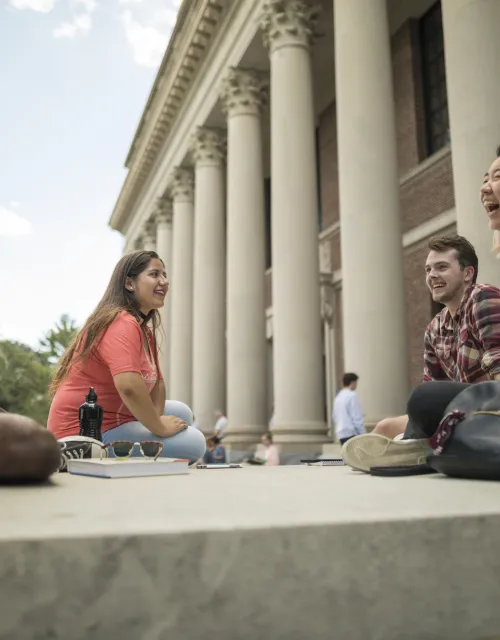 header image - students laughing on the steps of Widener Library