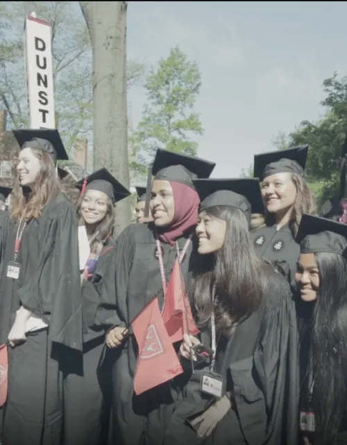 a group of students posing for a picture at graduation