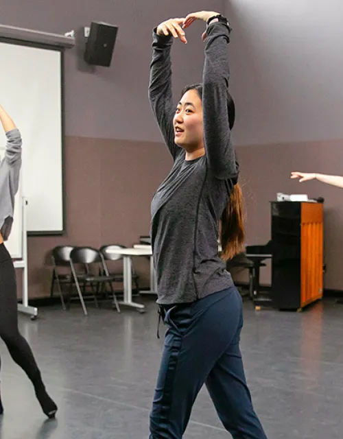 3 students rehearse ballet in a studio