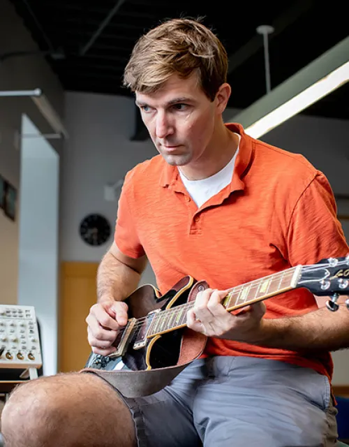  Robert Wood takes his guitar for a spin in preparation for his new course which combines engineering with music.
