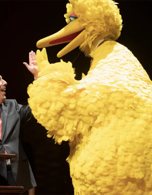 President Larry Bacow and Big Bird