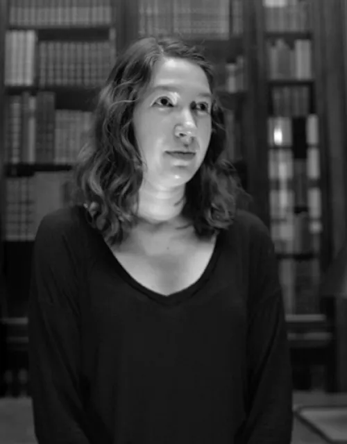 A student recites a collaborative story in the Harry Widener Memorial Room at Widener Library