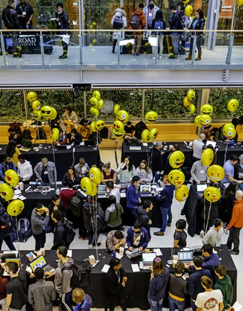 crowd of students in the Smith Campus Center walking around during the CS50 fair