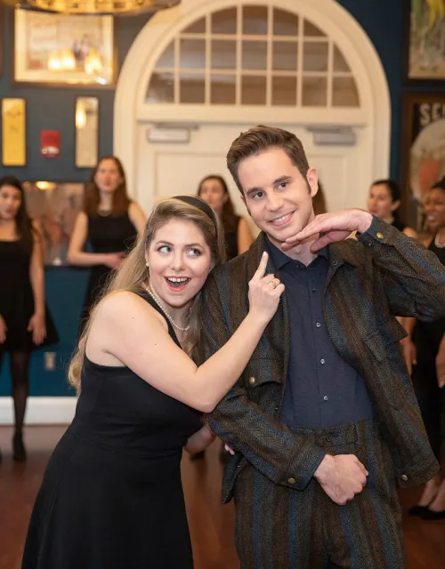 Ben Platt (right) is entertained by Sydney McDonald '21 and the Radcliffe Pitches.