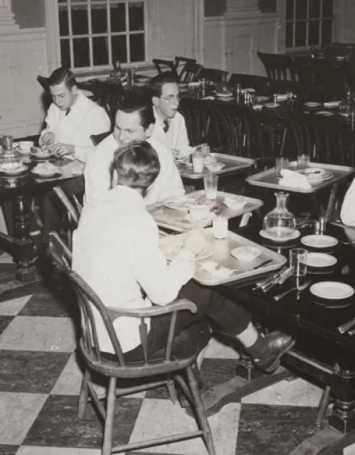 In this 1943 photo, student waiters are shown in the Lowell House dining room.