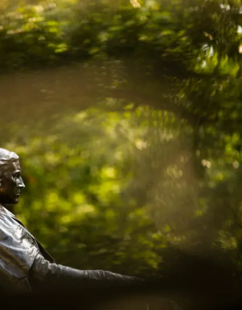 The John Harvard Statue overlooks Harvard Yard.