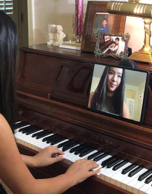 Lucy Tu recording a piano piece for her students.