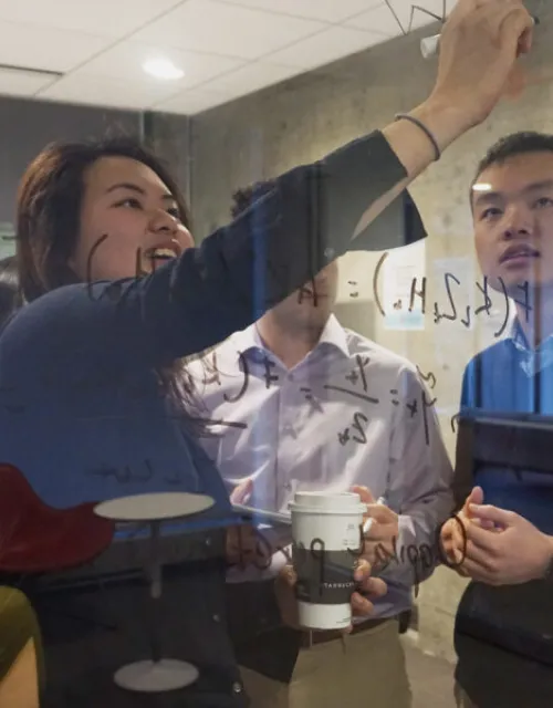 Harvard College Data Analytics Group CEO Jerry Huang, pictured in pre-pandemic days with Karen Chan, decided his group would help others, including the World Health Organization, by providing "data-driven insights related to COVID-19."