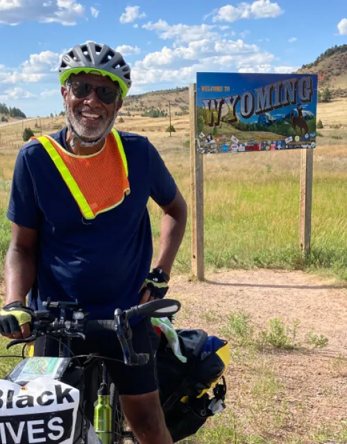 Professor Scott Edwards enters Wyoming on his bike.