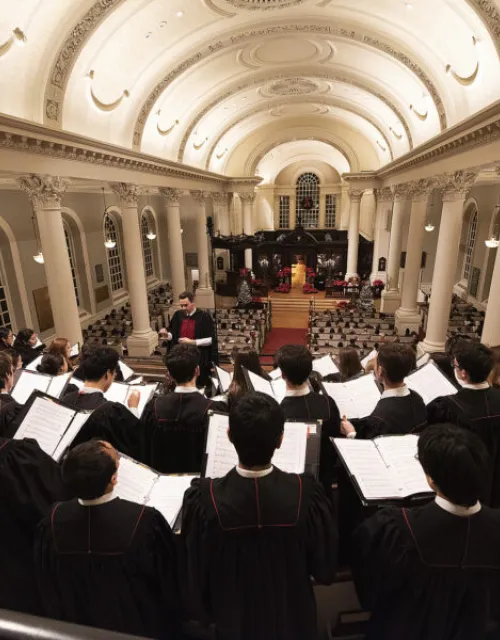 The choir performs at Harvard Memorial Church during a prior year's service.