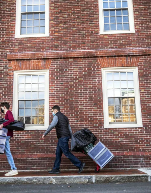 Drew Kelner ’22 moved into Lowell House with help from his dad, Mike Kelner, of Pembroke, Mass. Jan. 20 was the first day of move-in day for spring 2021 at Harvard University.