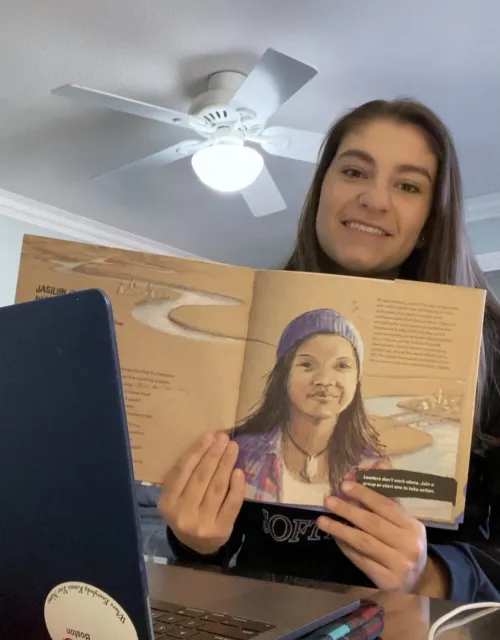 Lindsay Poulos ’23 shares “No Voice Too Small” with fourth-graders.