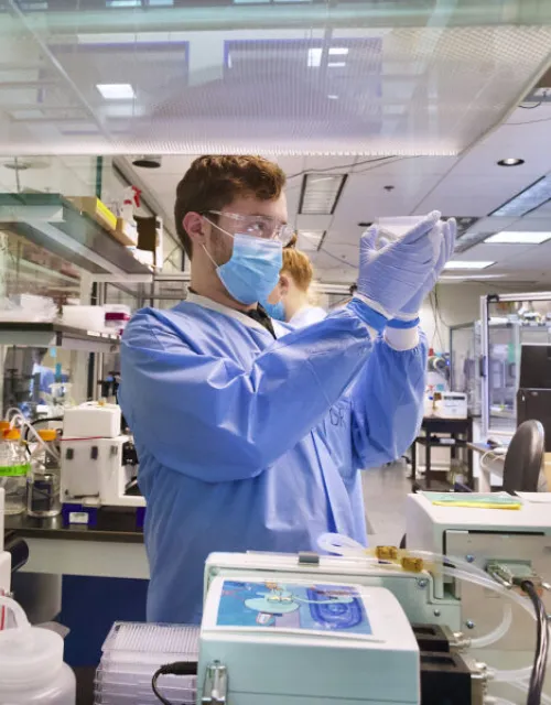 Daniel Roberts, an accessioning technician at the Broad Institute, conducts COVID-19 screening.