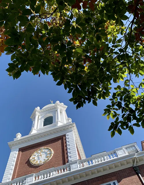 Looking up at the Lowell House clock tower.