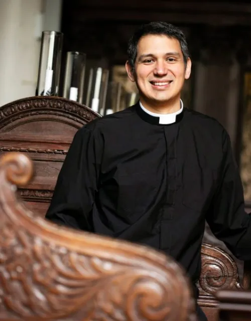 Professor of religious studies and literature is also Episcopal minister.