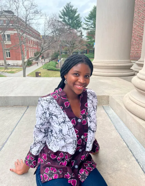 Juliet standing on Widener Library steps