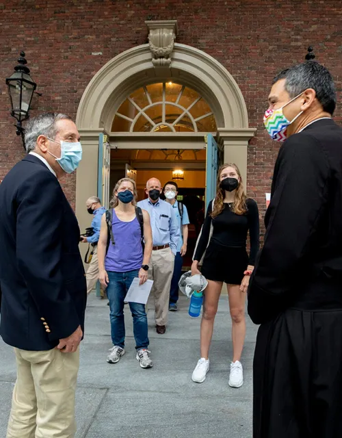 Harvard President Larry Bacow (left) and the Rev. Matthew Ichihashi Potts spoke following Morning Prayers at the Memorial Church.