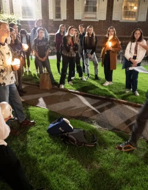 Outside Kirkland House, Lowell Brower (right) meets with students from his “Supernatural Storytelling” course. The students are headed to Kirkland's library to ask the resident spirit a few questions.