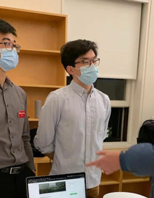 Michael Wu (left), '22, and Benjamin Chang, '24, present Rem, a peer-to-peer fundraising app.