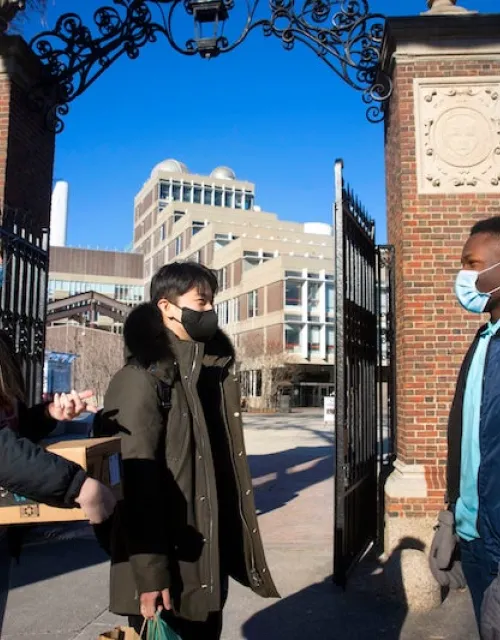 Beneath the Science Center gate, first-years Cara Salsberry (from left), Christian Um, and Ejike Ike chat. Beneath the Science Center gate, first-years Cara Salsberry (from left), Christian Um, and Ejike Ike chat.