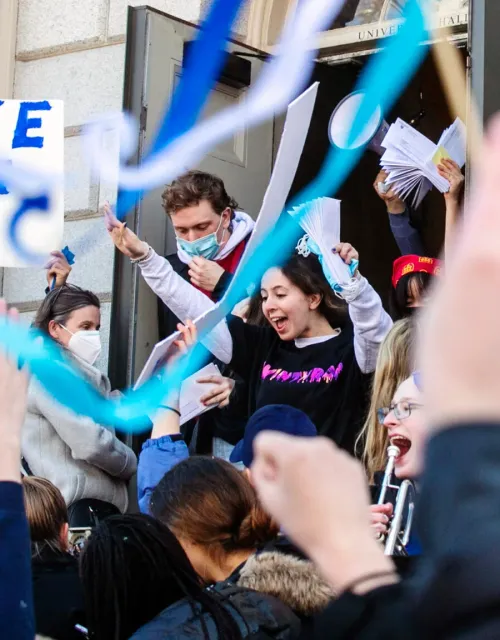 students in Harvard Yard on Housing day