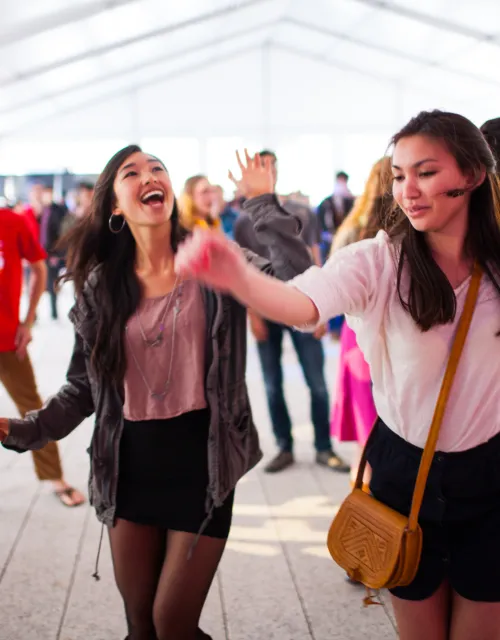 Two girls dancing in ARTS FIRST tent