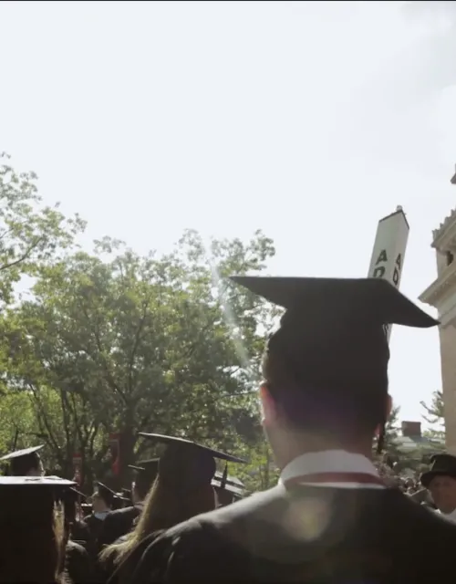 Commencement crowd walking in Tercentenary Theater.