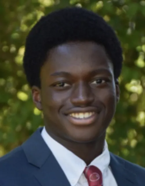 A photo of Zoungrana smiling. 