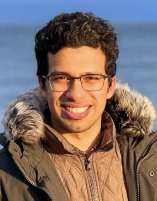 Computer science student, Mate, smiling. 