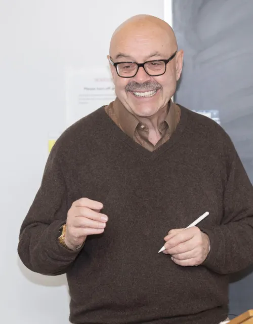 Sociology Professor Chris Winship gives lecture at blackboard