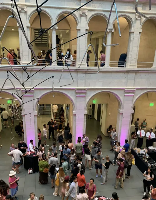 Museum visitors enjoying Harvard Art Museums at Night in the Calderwood Courtyard.