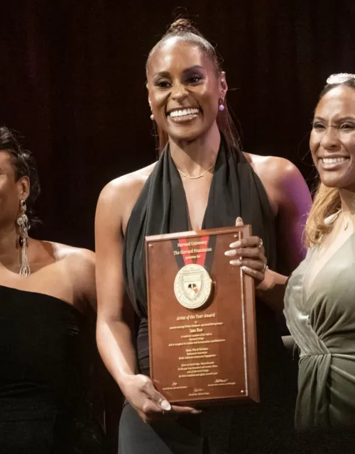 Artist of the Year Issa Rae (center) with Alta Mauro, associate dean of students for inclusion and belonging (left), and Sade Abraham, senior director of the Harvard Foundation for Intercultural and Race Relations.