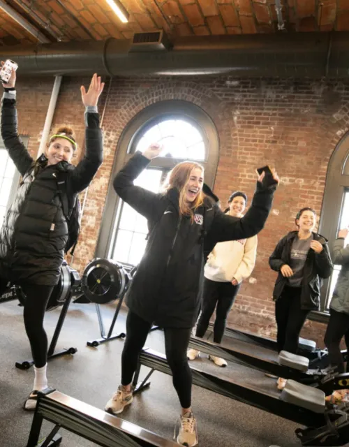 Members of the women's rowing teams test out the new sound system and some dance moves in the newly renovated Weld Boathouse.