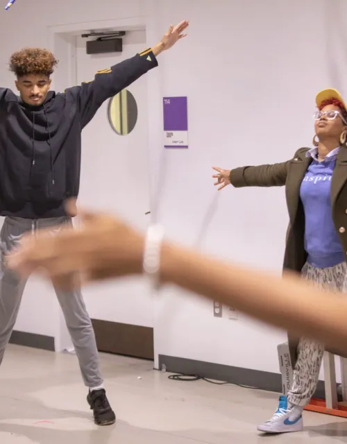 Students and teachers stretching in class