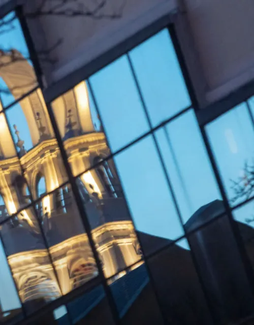 Memorial Church is reflected in the windows of the Graduate School of Design’s Gund Hall. 