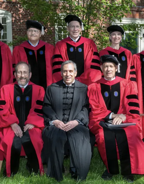 Honorands Katalin Karikó (clockwise from top left), David Levering Lewis, Michael Mullen, Jennifer Doudna, Hugo Noé Morales Rosas, and Tom Hanks join President Larry Bacow and Provost Alan Garber in Harvard Yard following the Morning Exercises.
