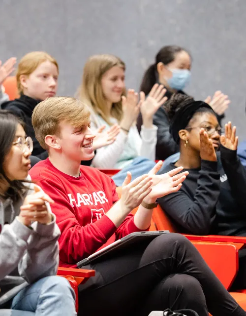 Harvard students sitting in class.
