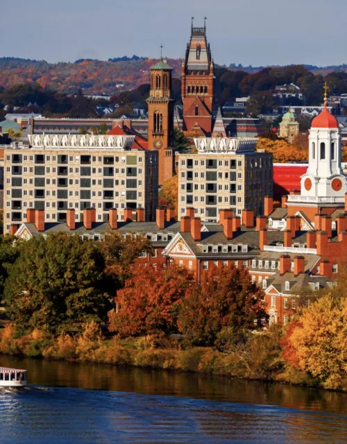 Fall foliage adds dazzling color to the view of campus from across the Charles River.