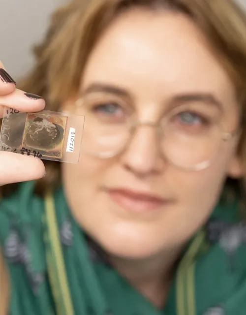 Sarah Losso with one of the trilobite glass slides.
