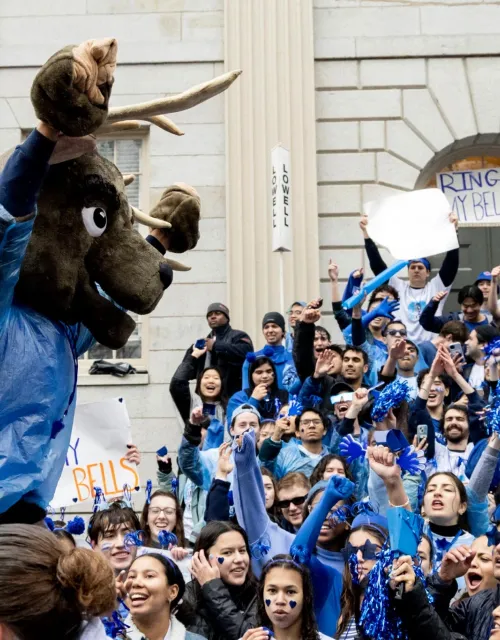 Lowell House students cheer for their House on the steps of University Hall in Harvard Yard on Housing Day.