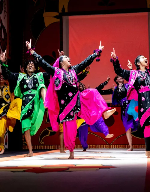 Students dancing together on stage