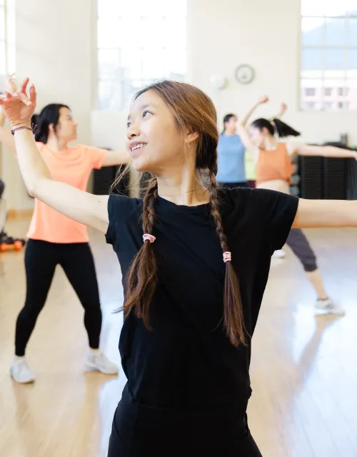 Students practicing a dance together
