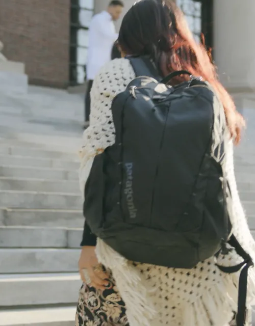 Student walks up stairs of library