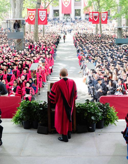 Tercentenary theatre filled with students in caps and gowns.