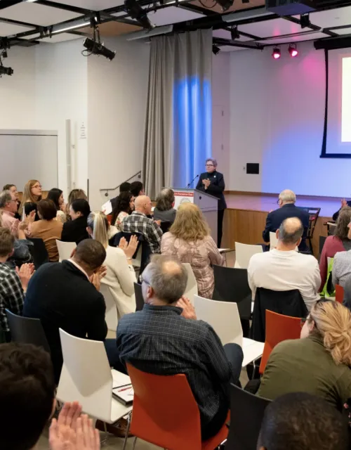 City Councilor Liz Breadon (at podium) at the Harvard Ed Portal.