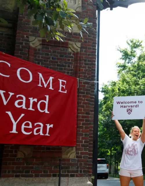 Seniors Katrina Geiersbach (from left), Cecilia Nakfoor, and Nico Vasquez welcome the first-years at Johnston Gate.